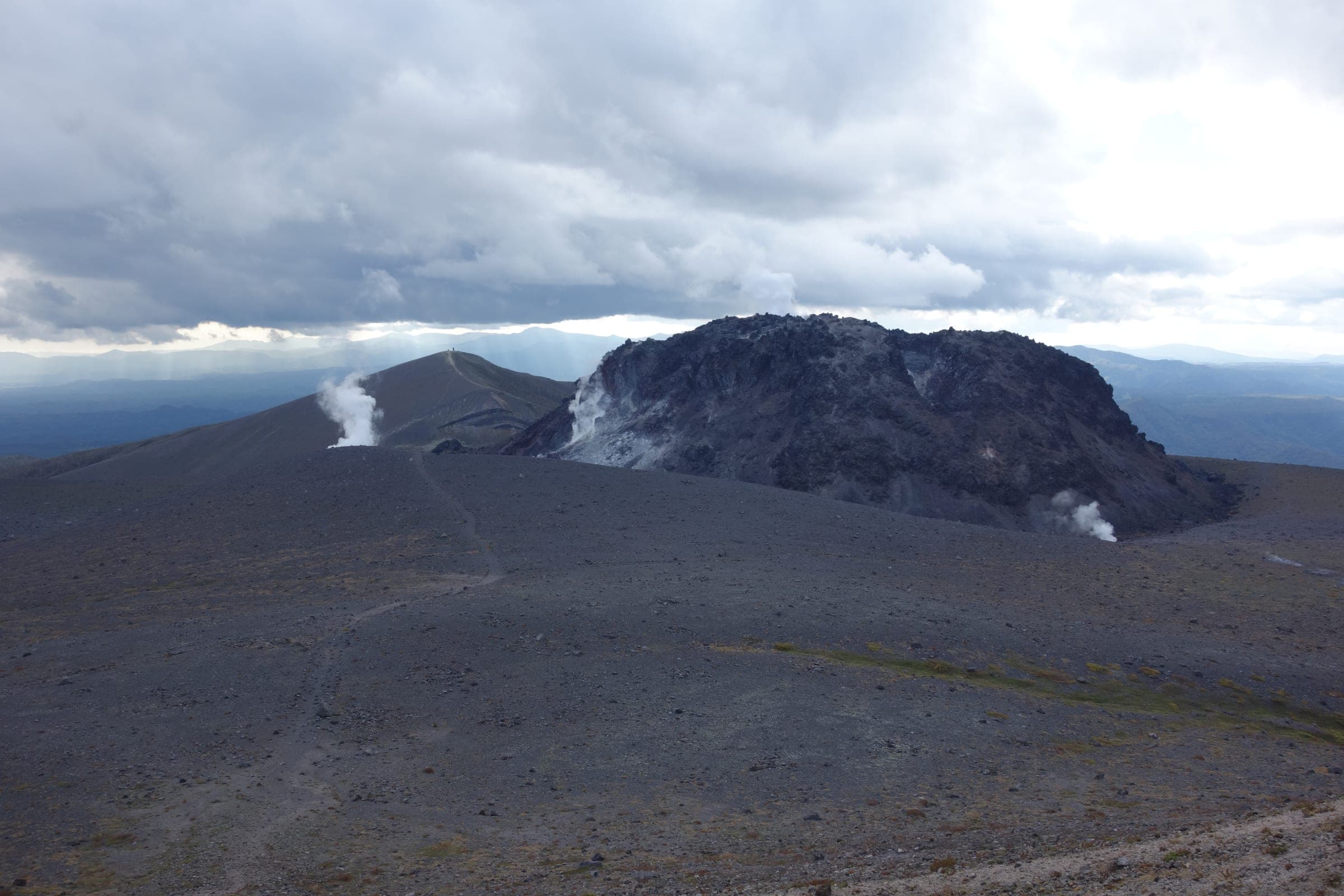 Steam rises from the dark lava dome at the top of Tarumae-zan
