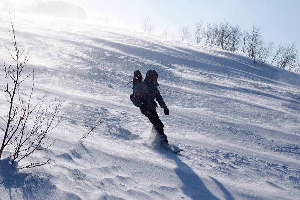 A snowboarder rides wind-blown snow on the slopes of Maetokachi-dake in the Tokachi range