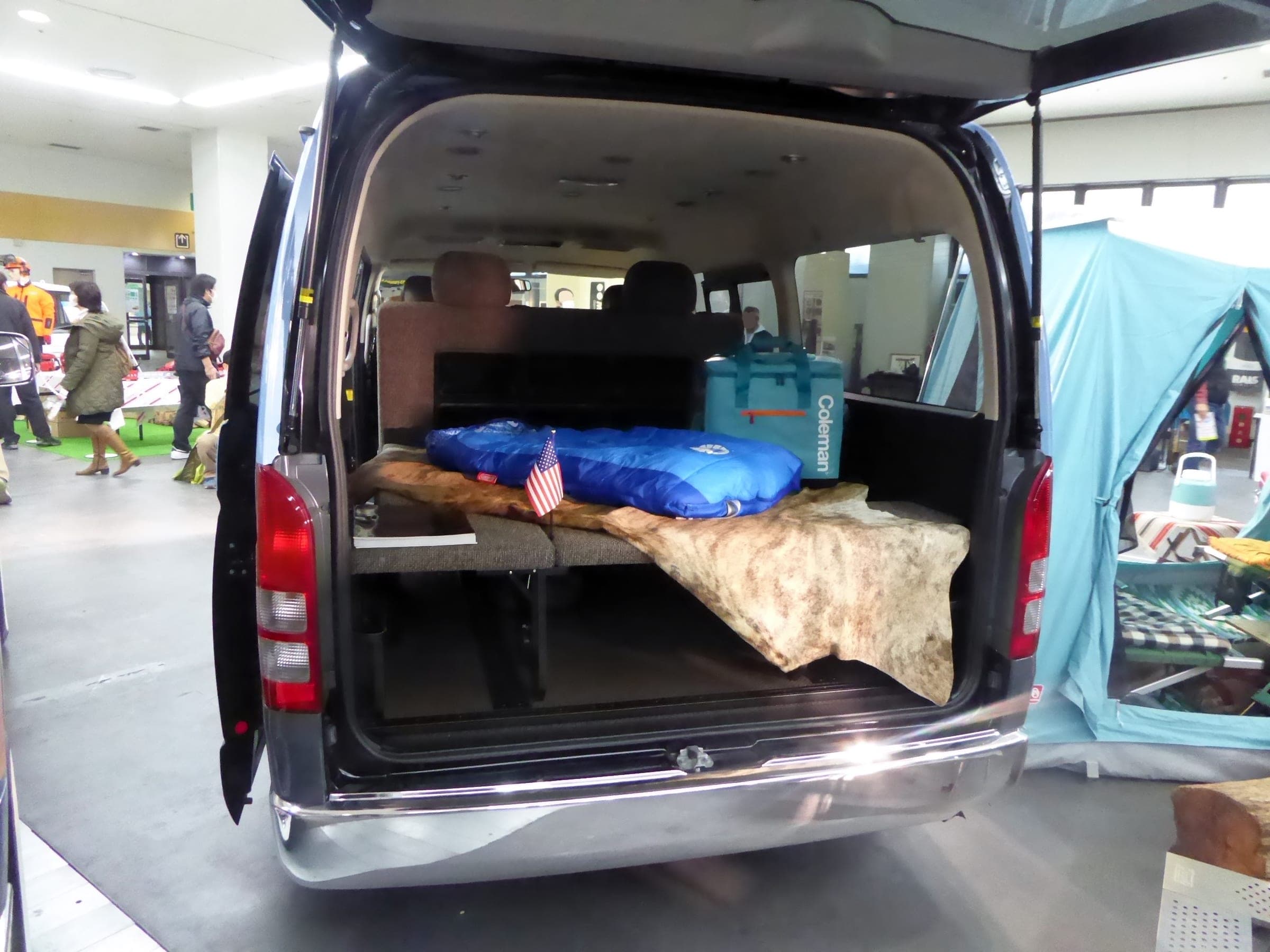A Toyota Hiace with a bed kit in the back, the kind of conversion Camping Labo rents