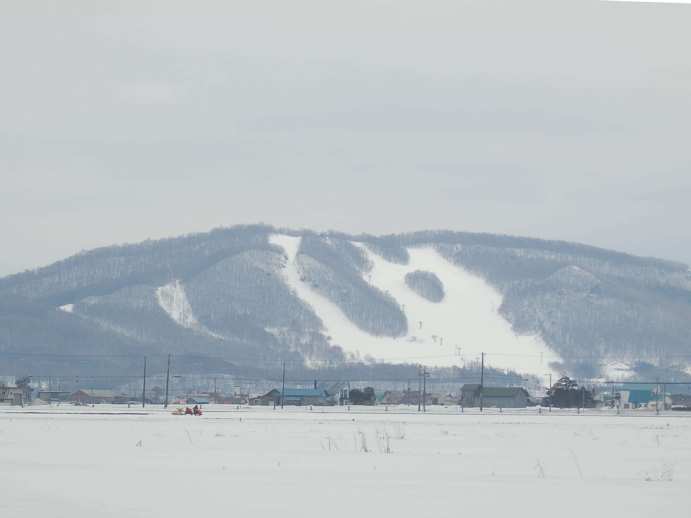 Canmore Ski Village near Asahikawa under snow, where Carstay sells overnight spots in the car park