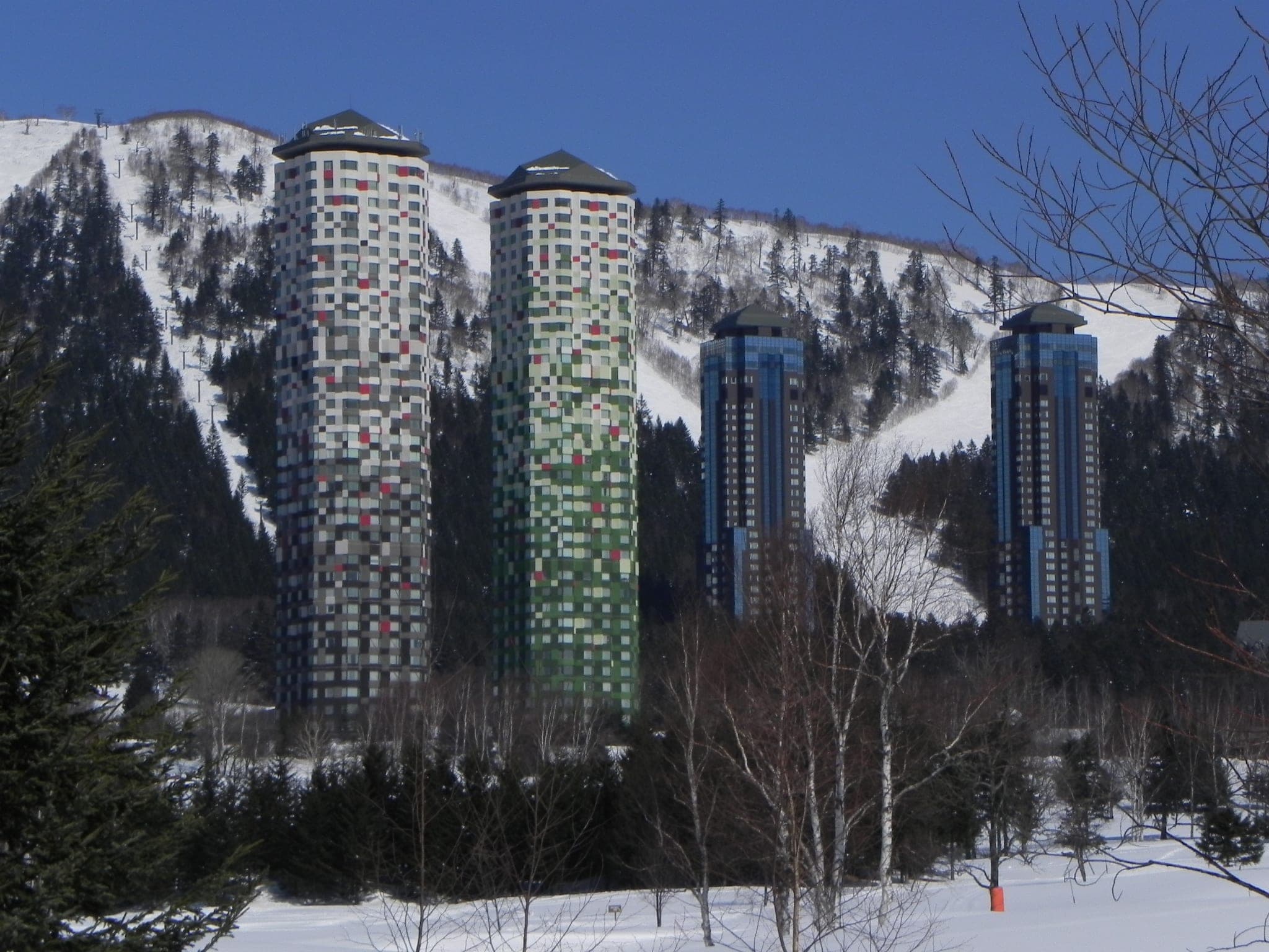 The Tomamu towers above snowy ski runs, a stop on the Japan CRC and Hoshino Powder Belt camper plan