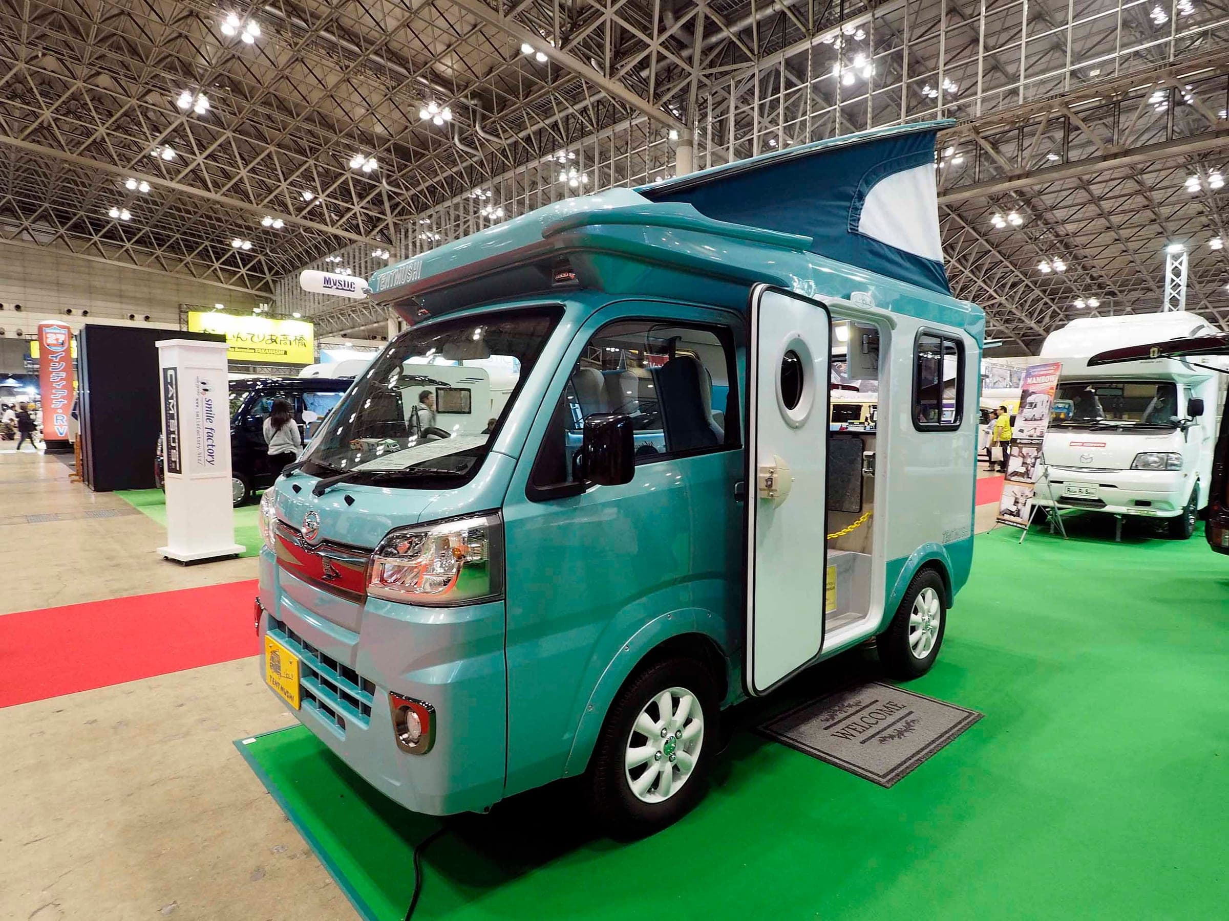A Tentmushi camper on a Daihatsu Hijet kei truck, the same base as Japan CRC's Happy1