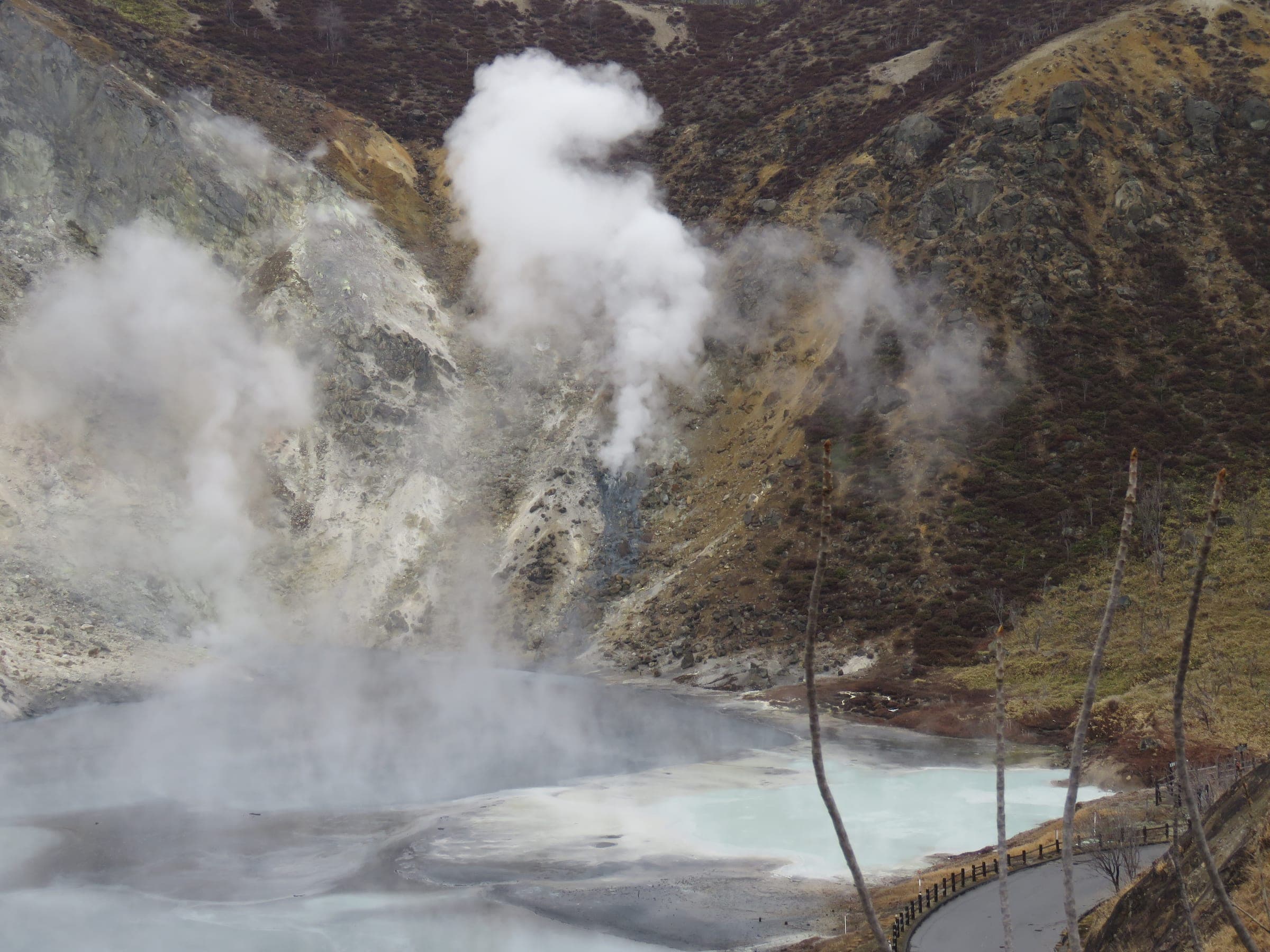 Steam vents pour over the edge of the Oyunuma pond that feeds the Noboribetsu river footbath