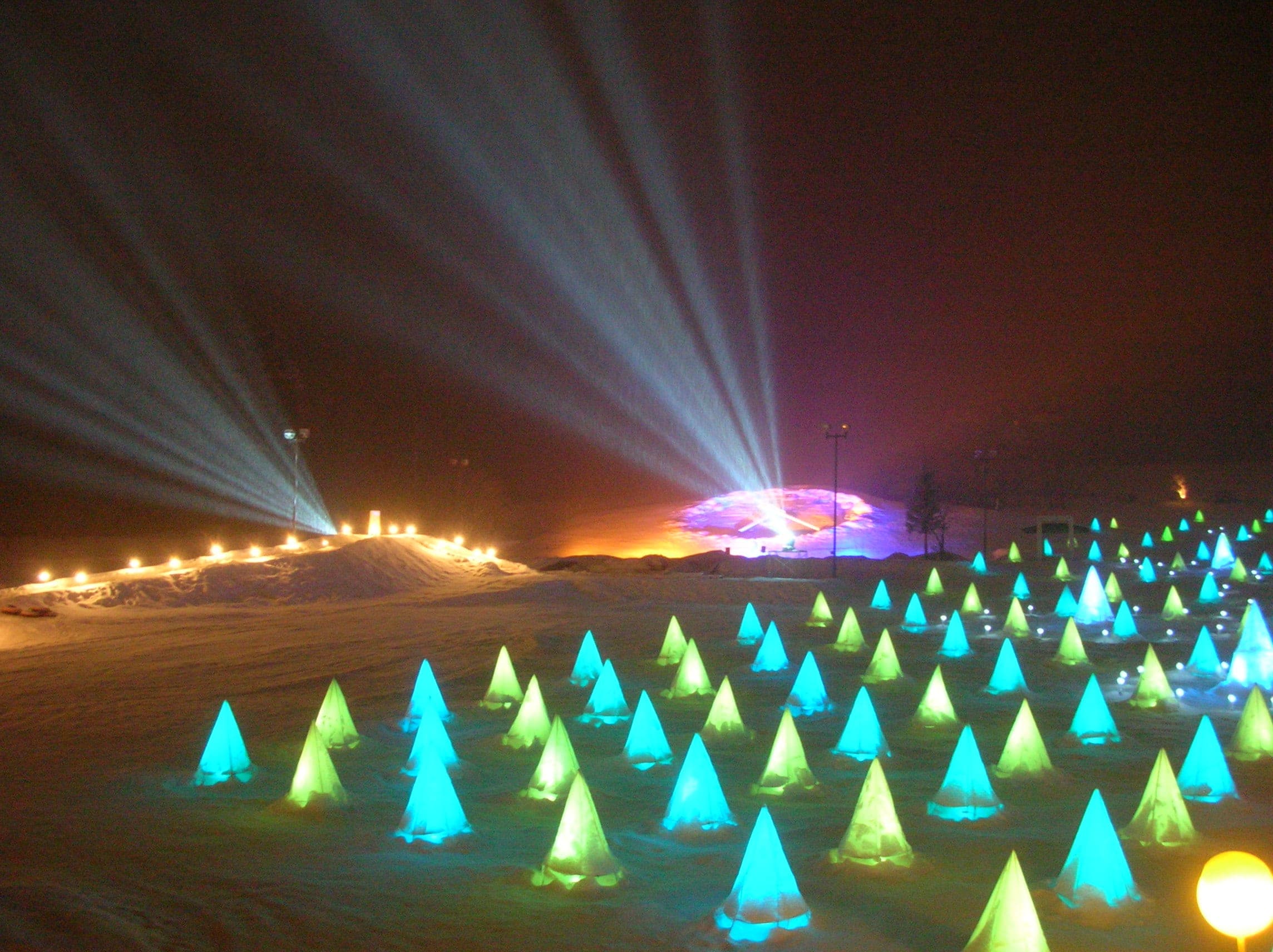 Searchlights and coloured cones light a snowfield at the Sairinka festival in Tokachigawa Onsen