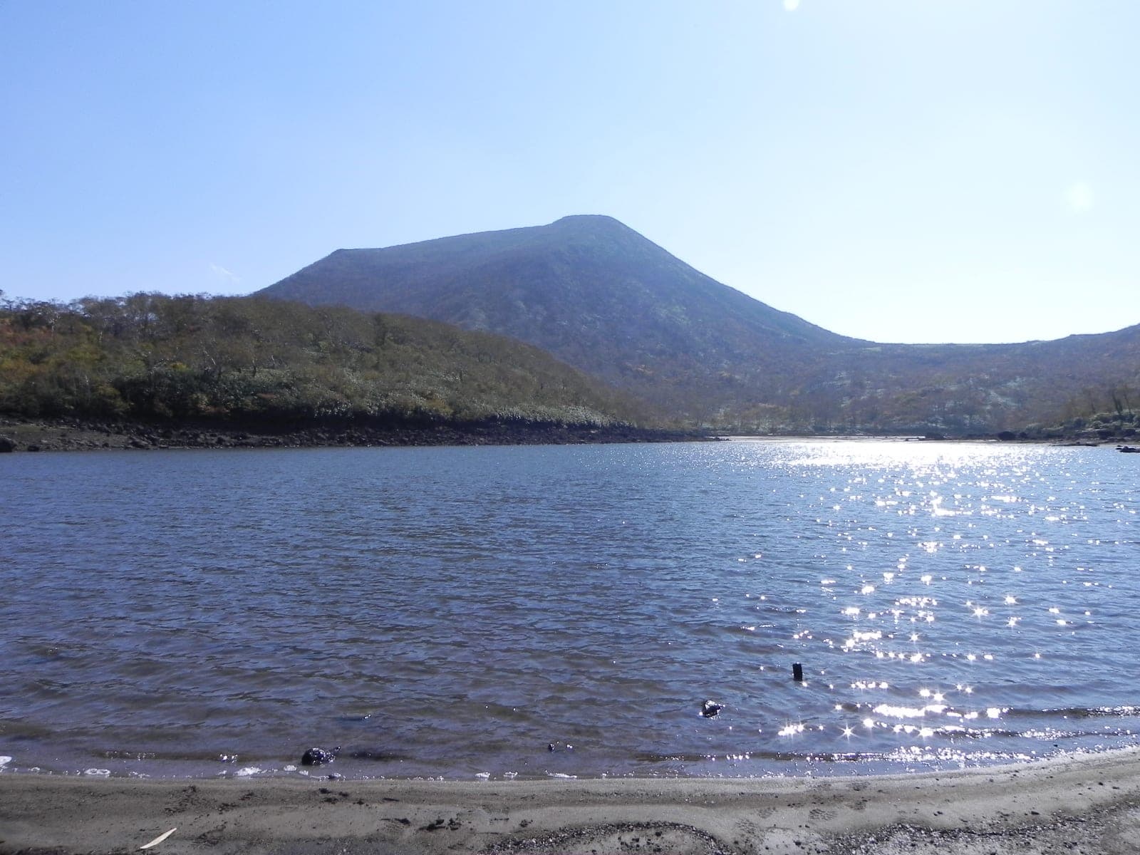 Mt. Chisenupuri rises above the low summer waters of Naganuma Pond in the Niseko range