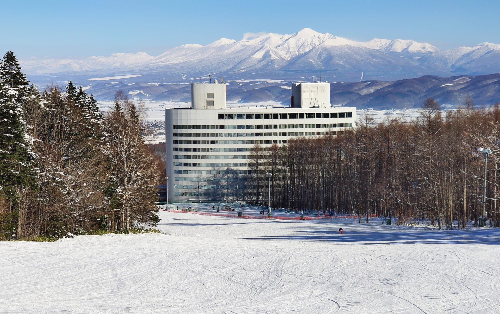 The New Furano Prince Hotel stands below the Prince run with the snowy Tokachi range beyond