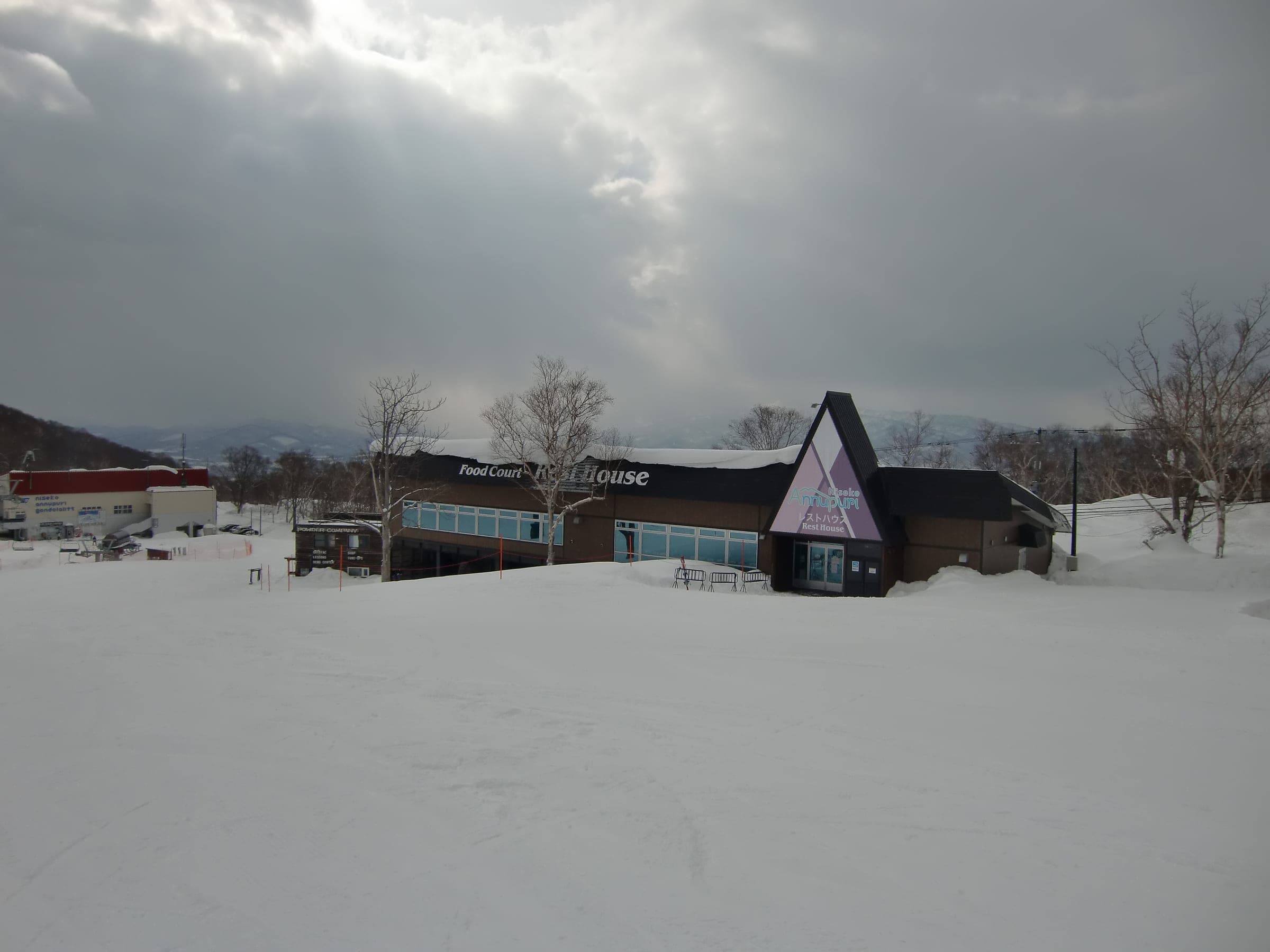 The Niseko Annupuri rest house sits under heavy cloud at the edge of the slopes