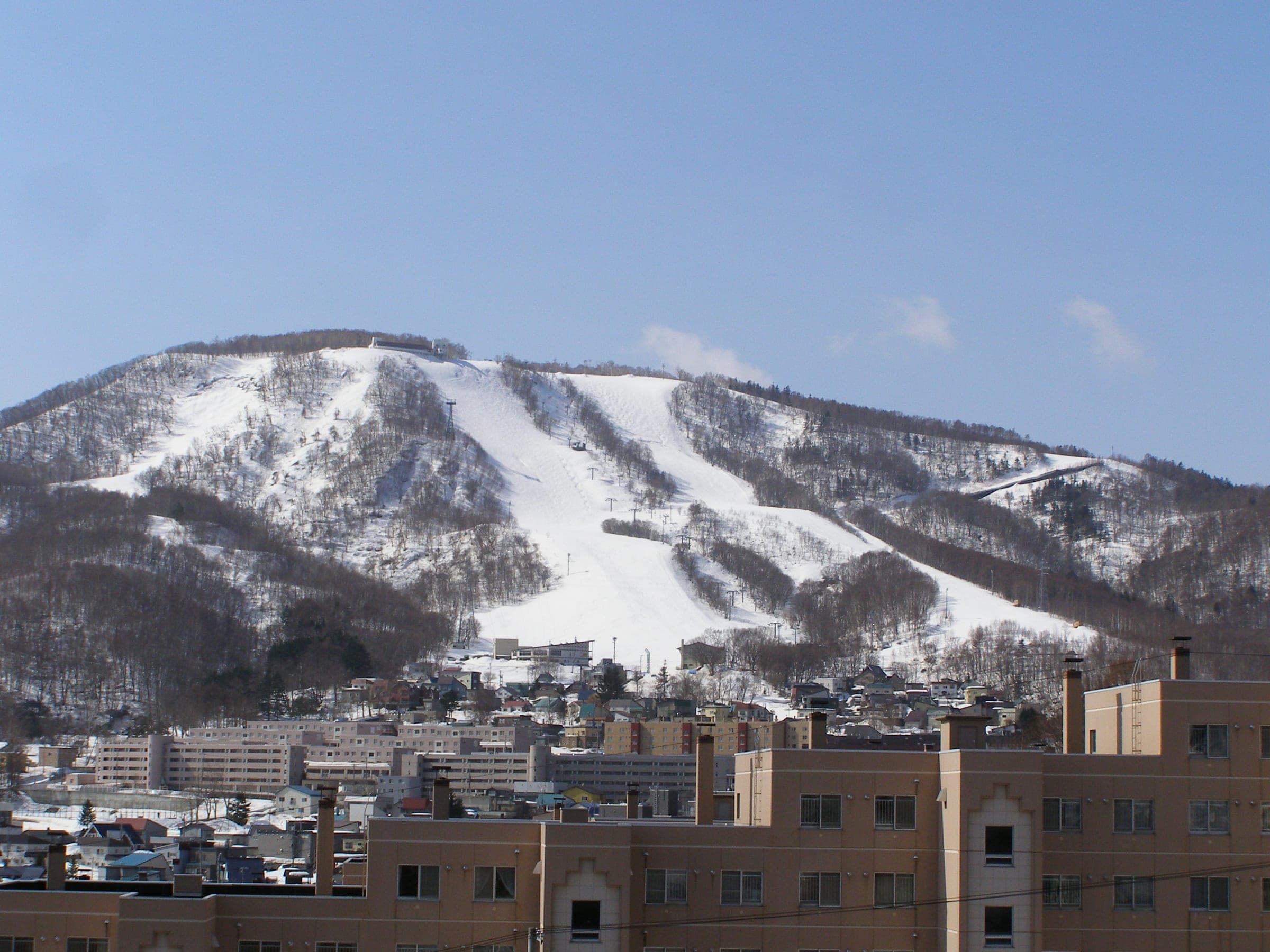 Otaru Tenguyama's ski runs spread down the snowy mountain above the rooftops of Otaru