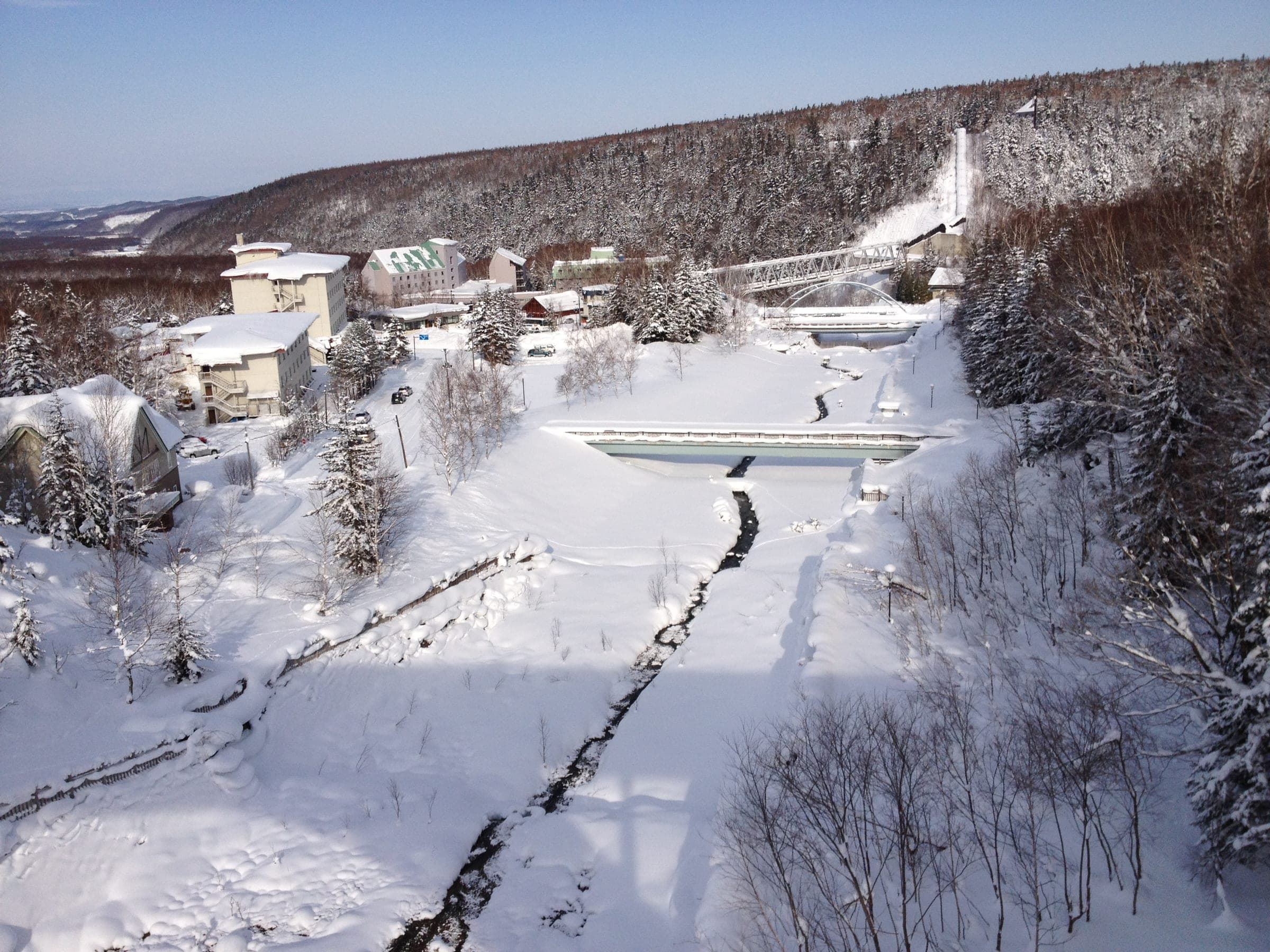 Deep snow buries the small hot spring hamlet of Shirogane Onsen where Aonobi Yuyu stands