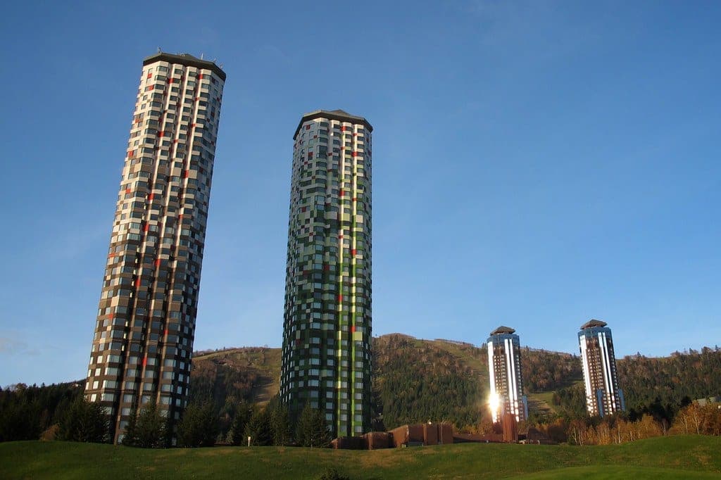 The Tower's two checkered towers against a blue sky at Tomamu