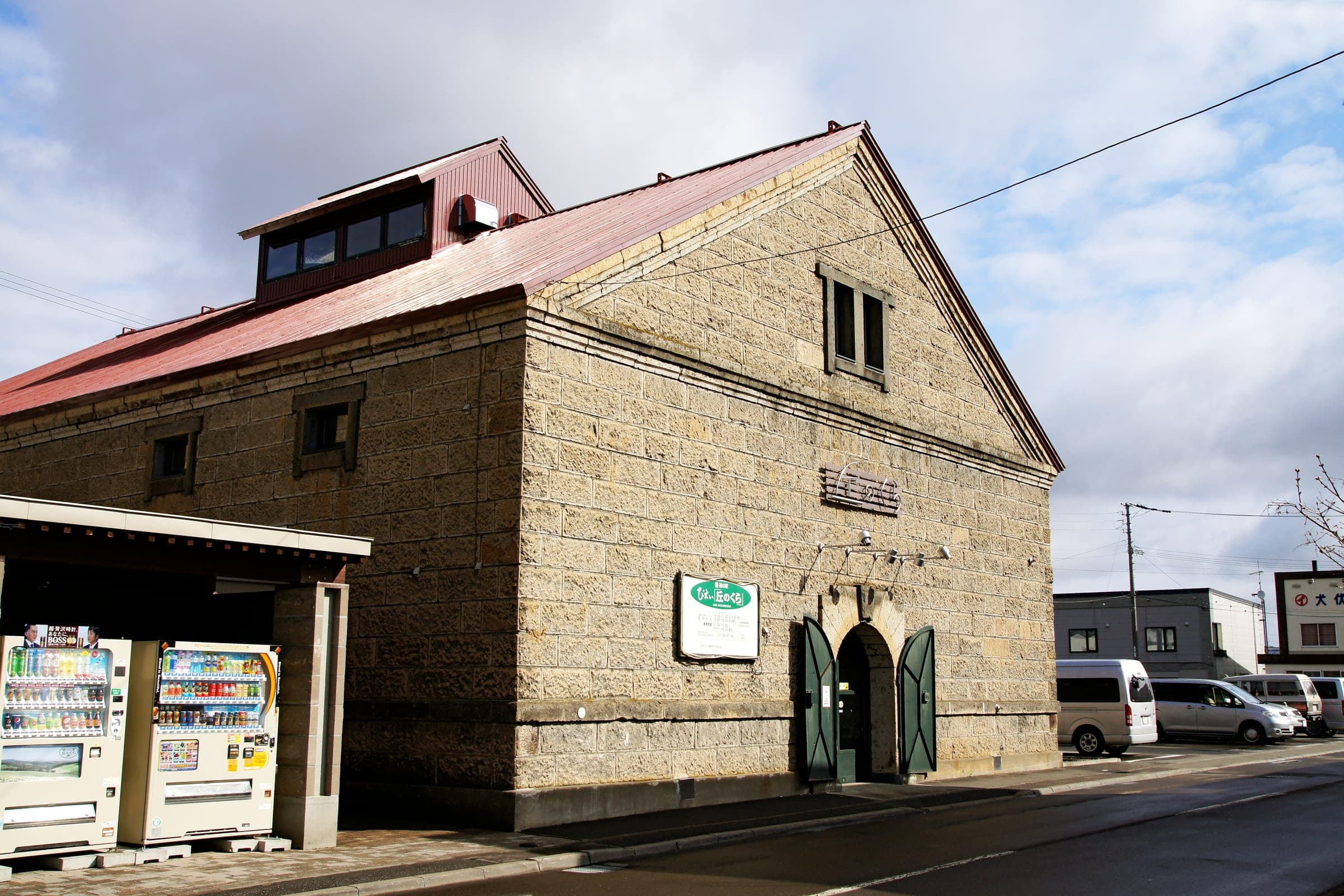 Biei's roadside station occupies the old Okanokura stone warehouse under a red roof