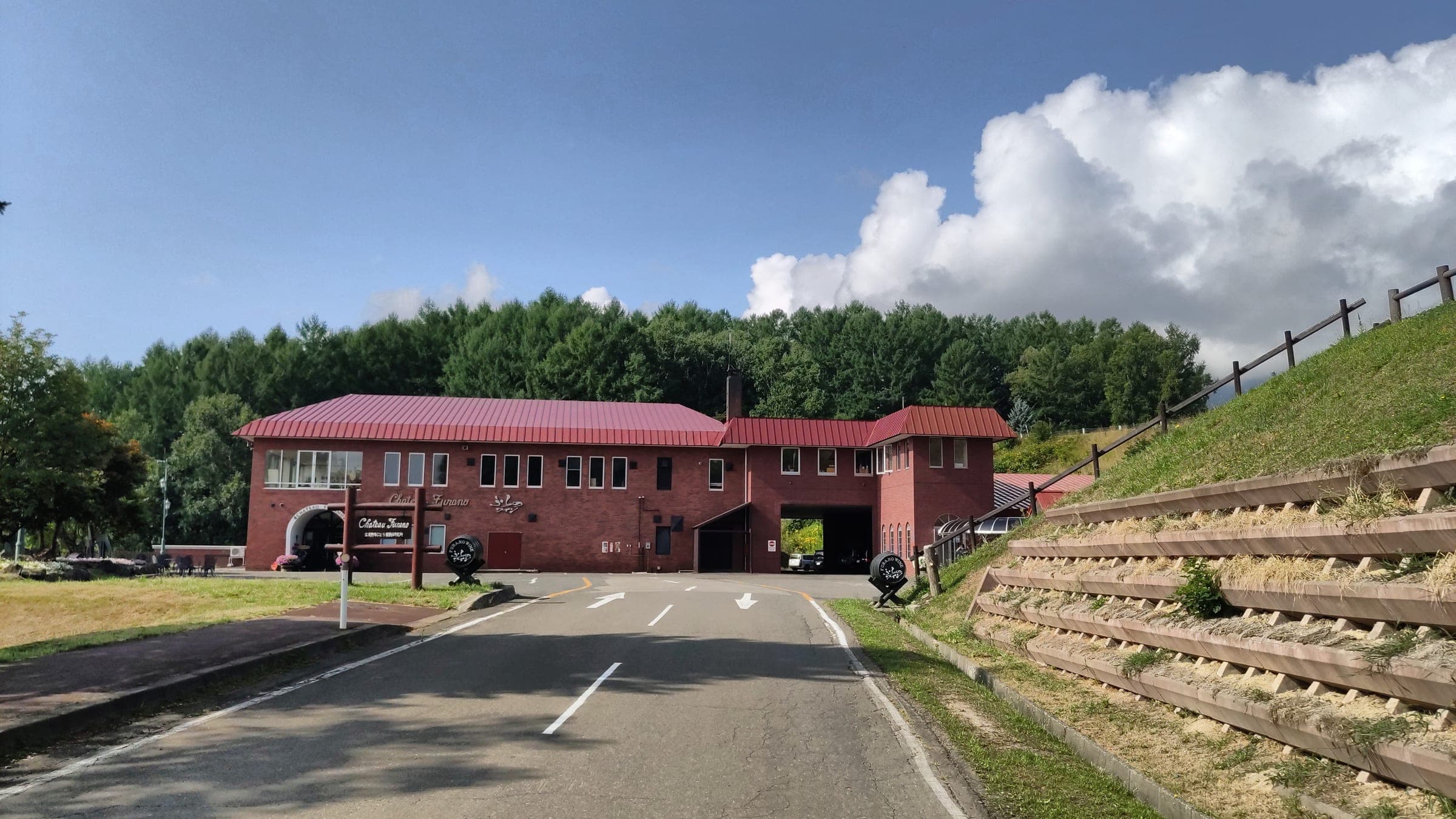 The red-roofed Furano Wine Factory building on its hill above the town