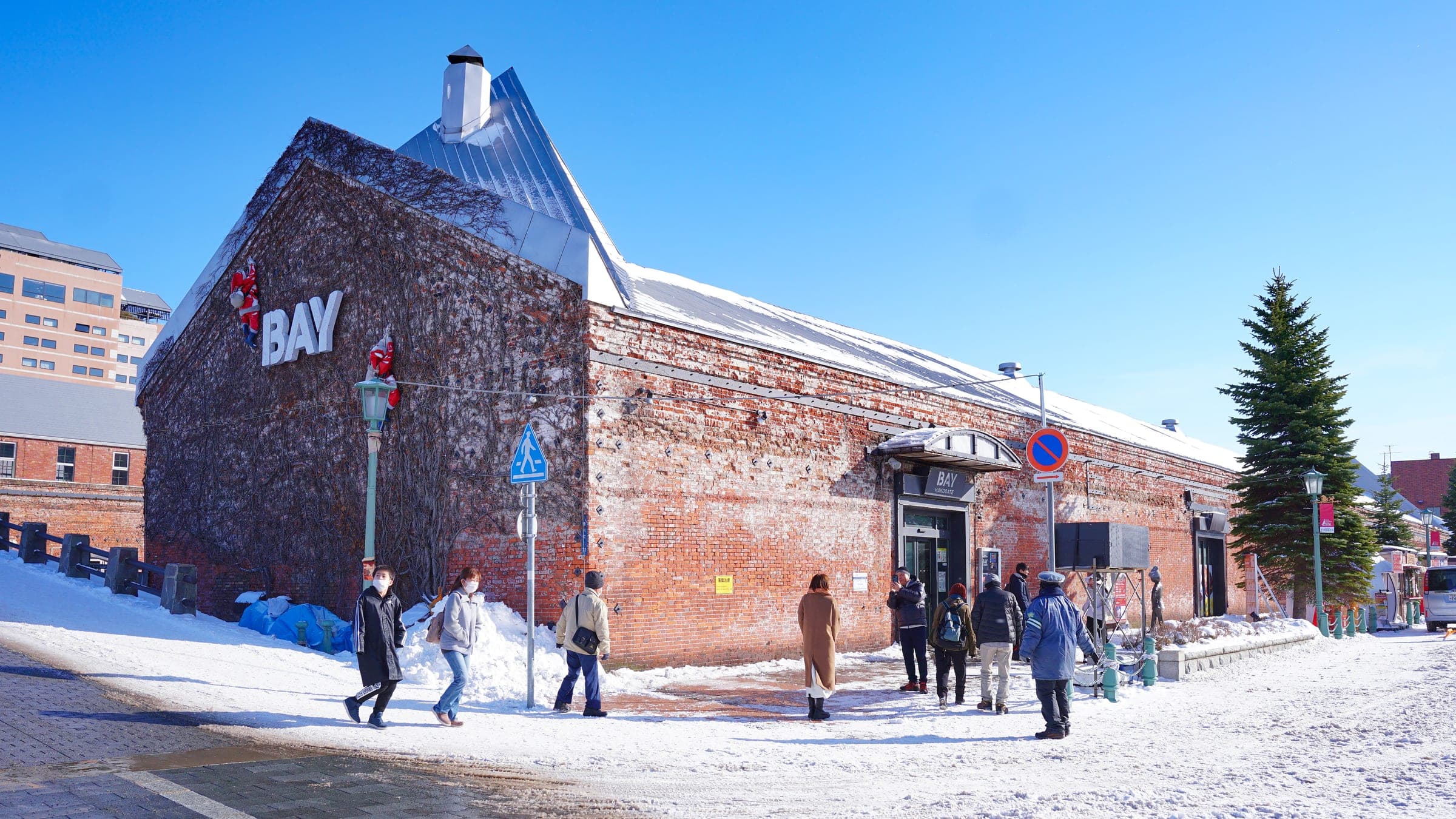 Snow lies in front of the Kanemori red-brick warehouses on the Hakodate waterfront