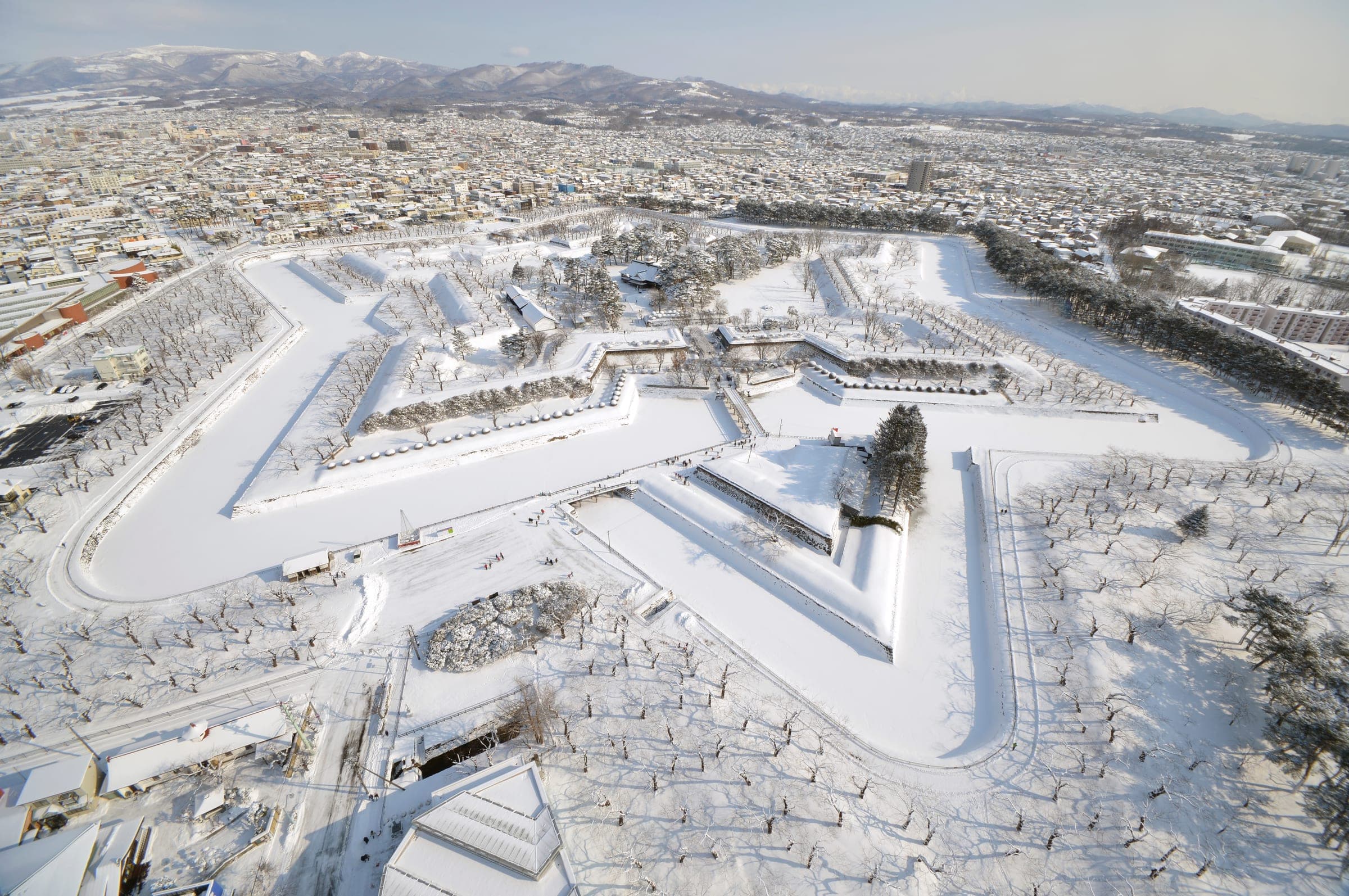 The star-shaped walls of Goryokaku stand out white under snow