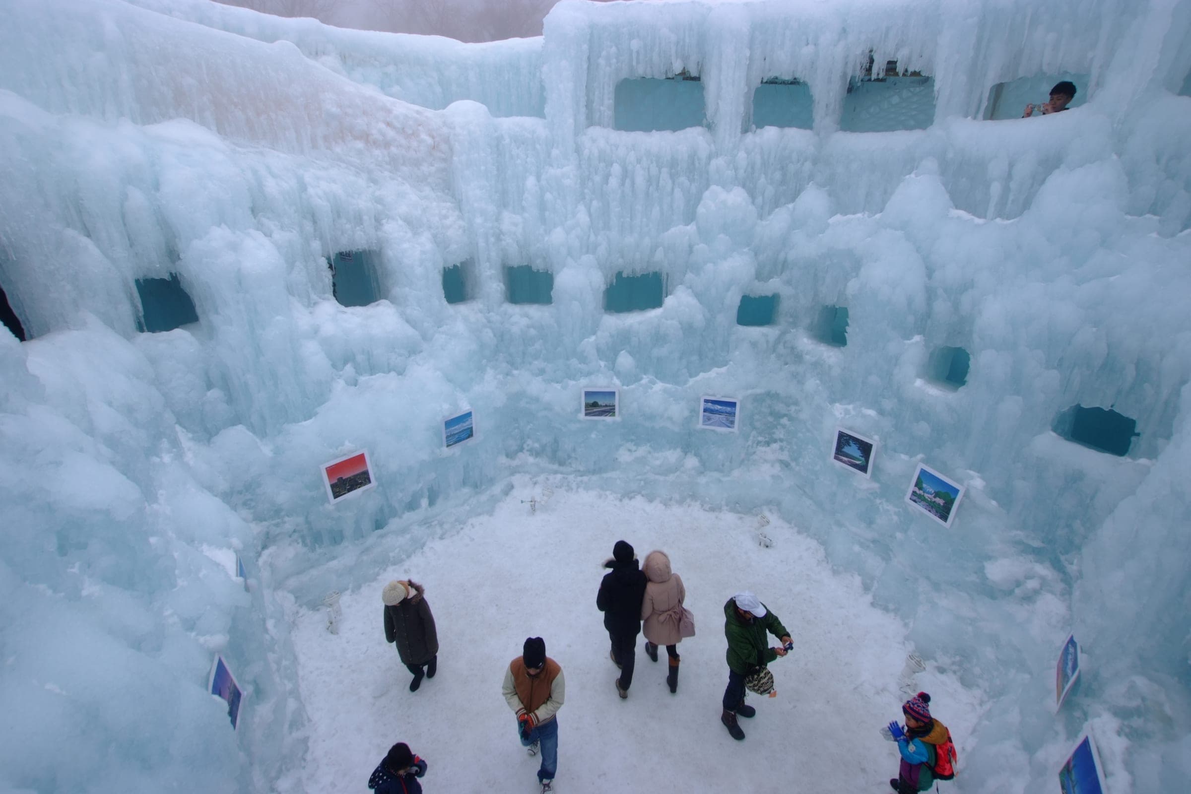 Ice walls and towers ring a snowy plaza at the Lake Shikotsu Ice Festival