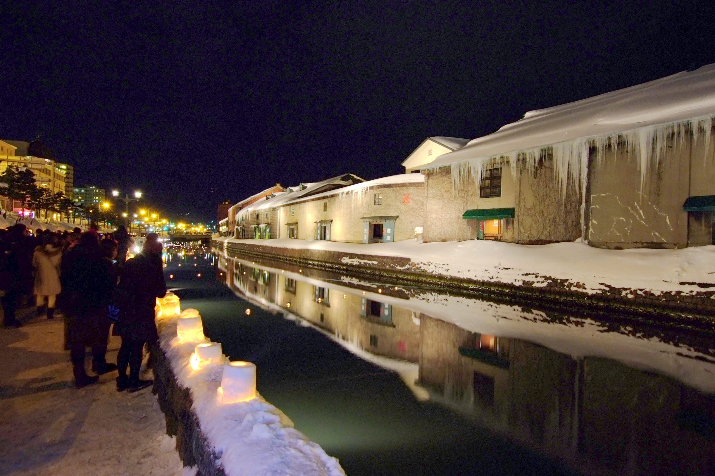 Snow lanterns glow along the Otaru Canal during the Snow Light Path festival