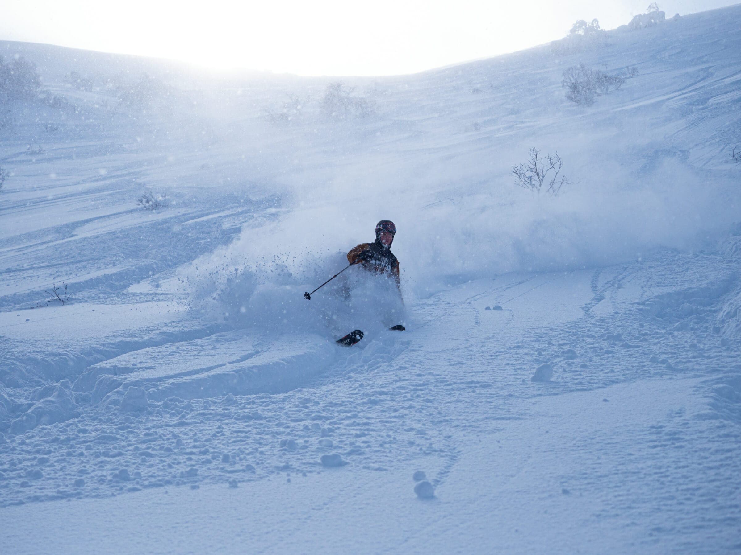 A skier sprays powder down the Kita-shamen north slope of Niseko Annupuri