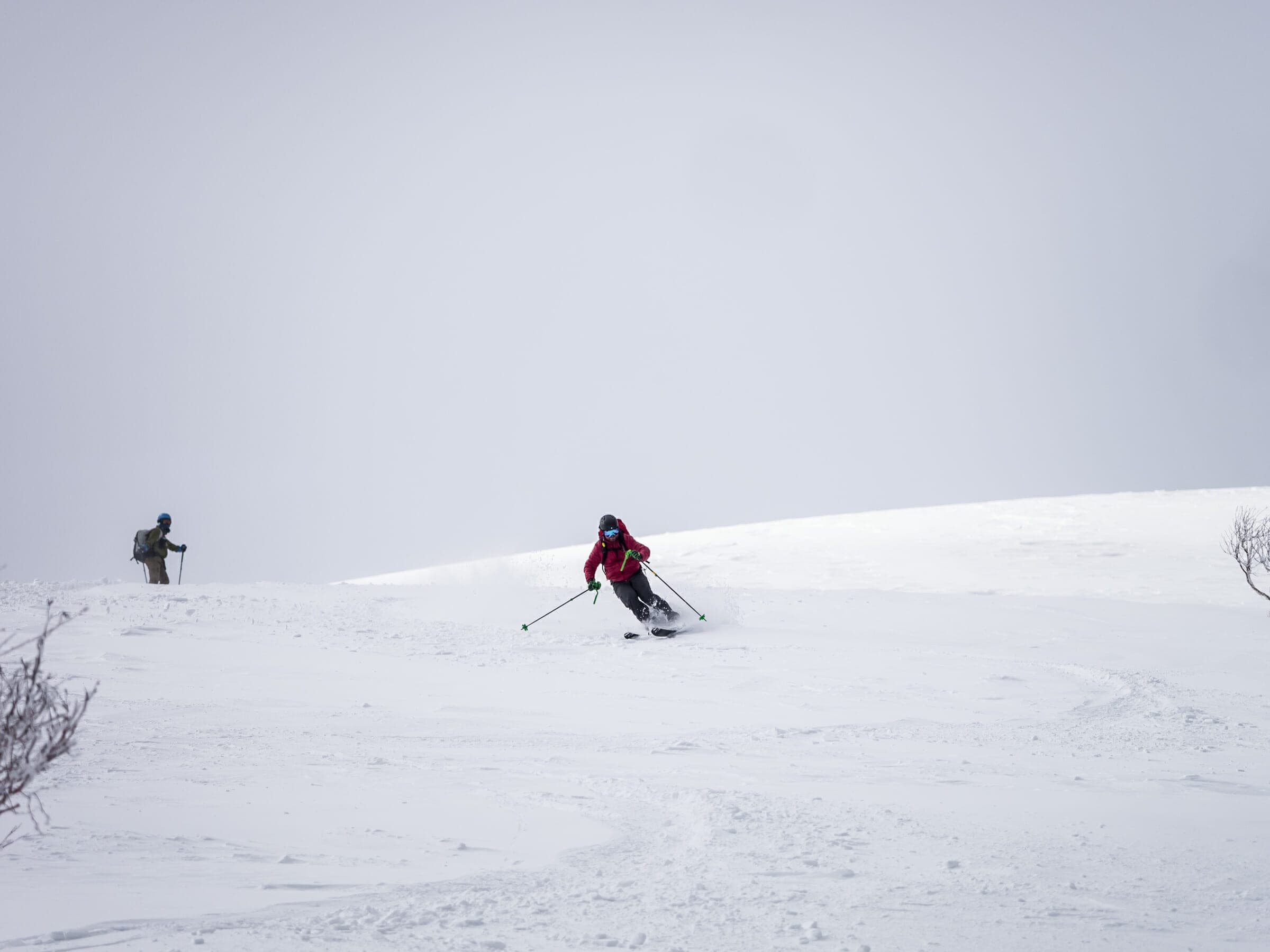 Two skiers descend the gentle open slopes of Weisshorn in the Niseko Range