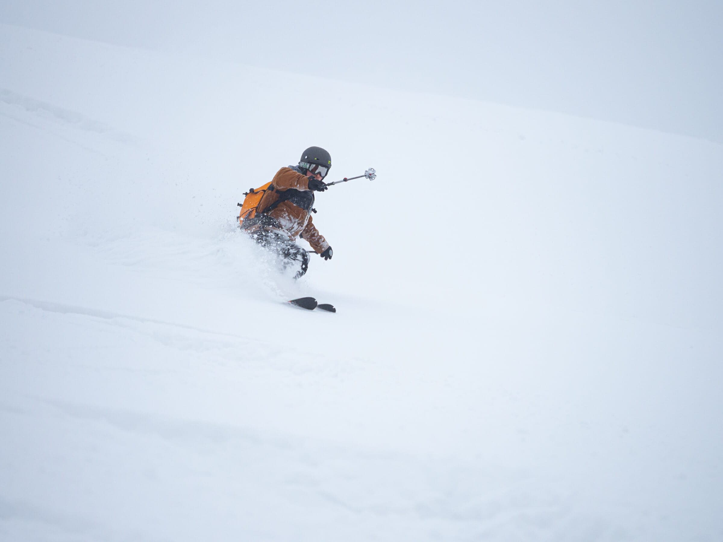 A skier turns through deep powder on the southeast face of Chisenupuri