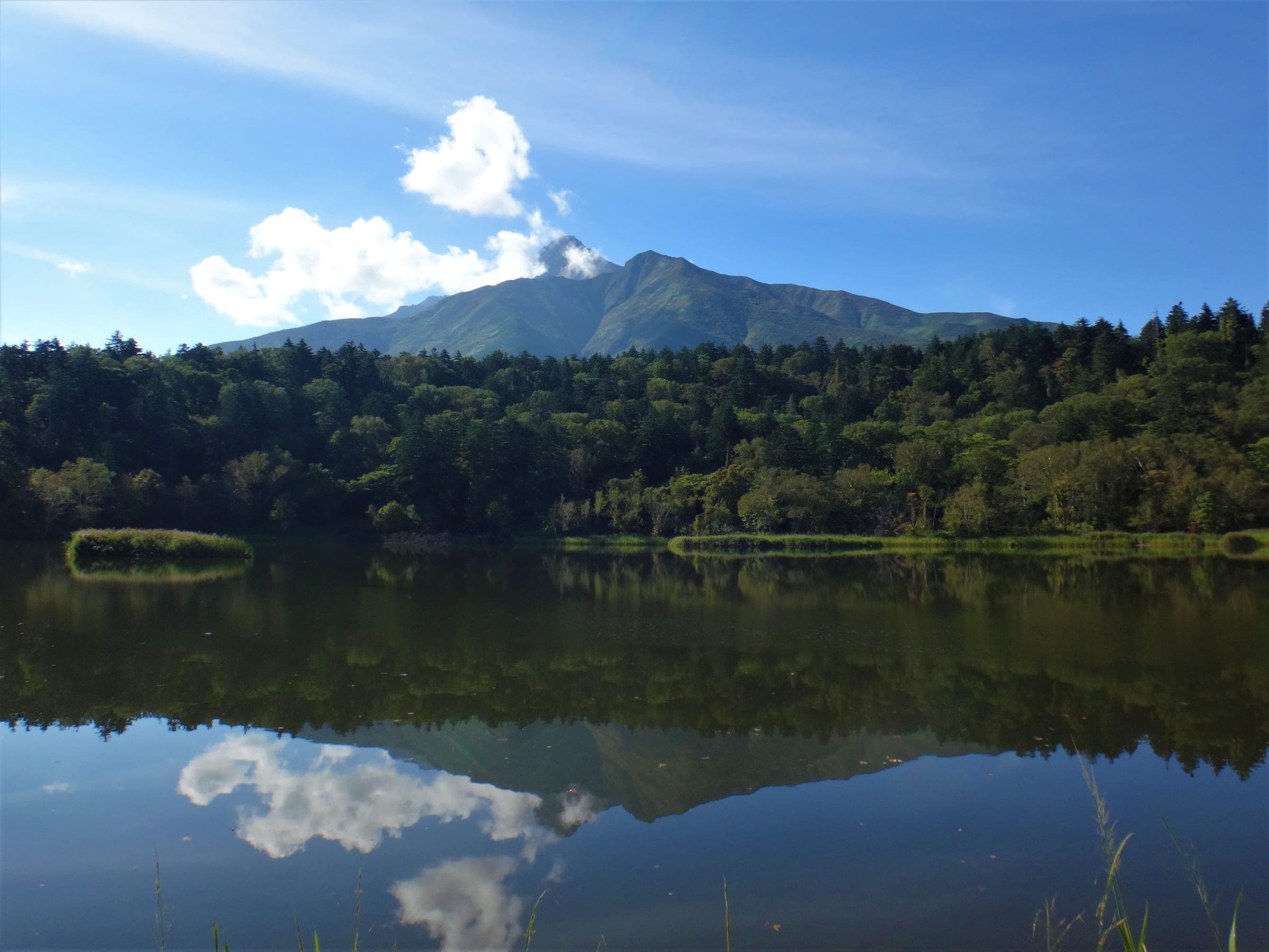 Rishiri-zan reflected in the still water of Himenuma pond in summer