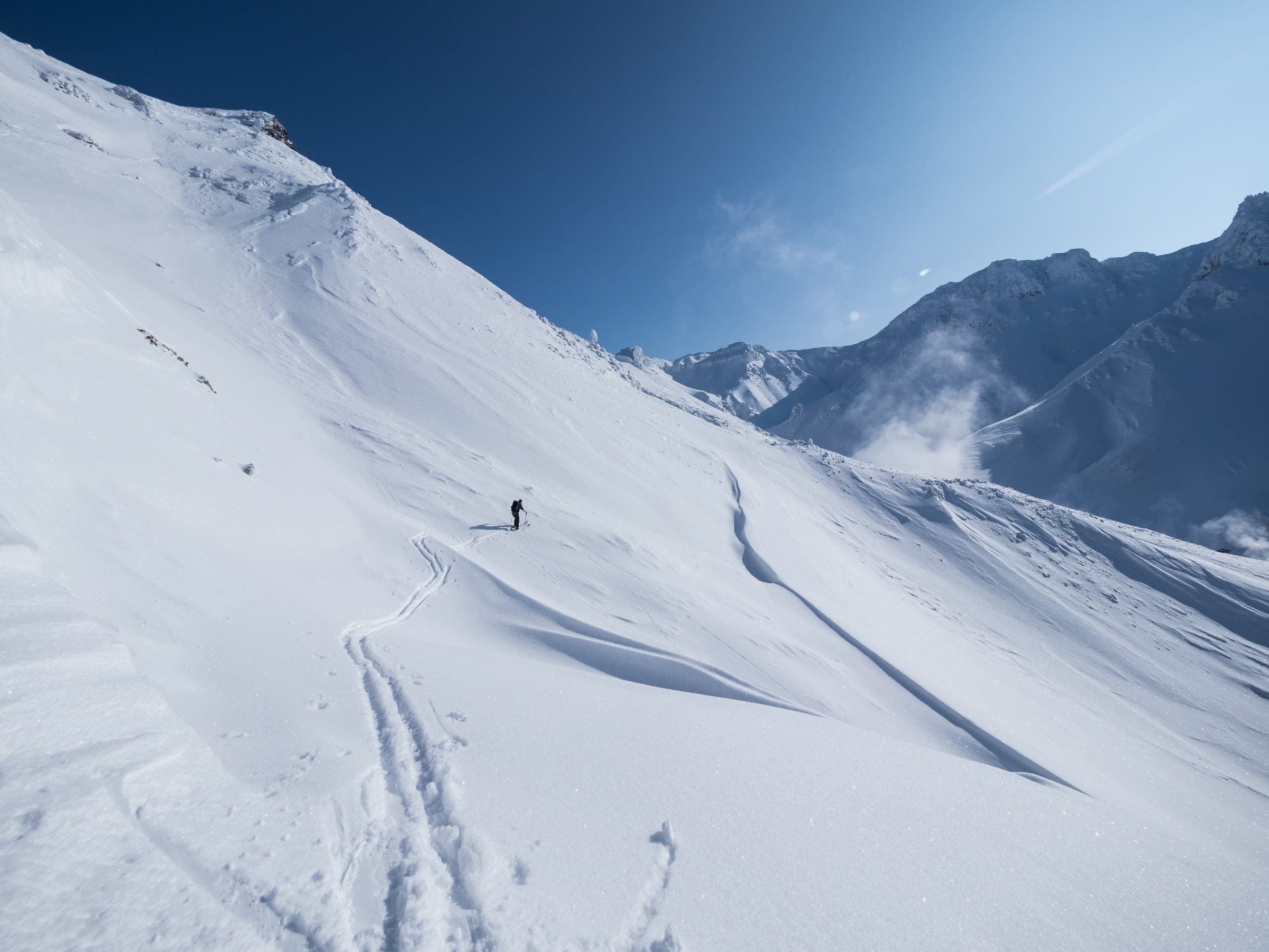 Ski tracks run down the Kamihoro valley below Ansei Crater in the Tokachi Range