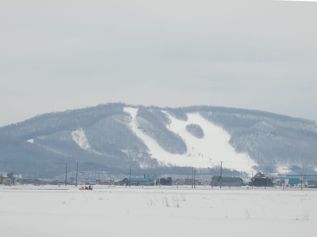 Canmore Ski Village near Asahikawa under snow, where Carstay sells overnight spots in the car park