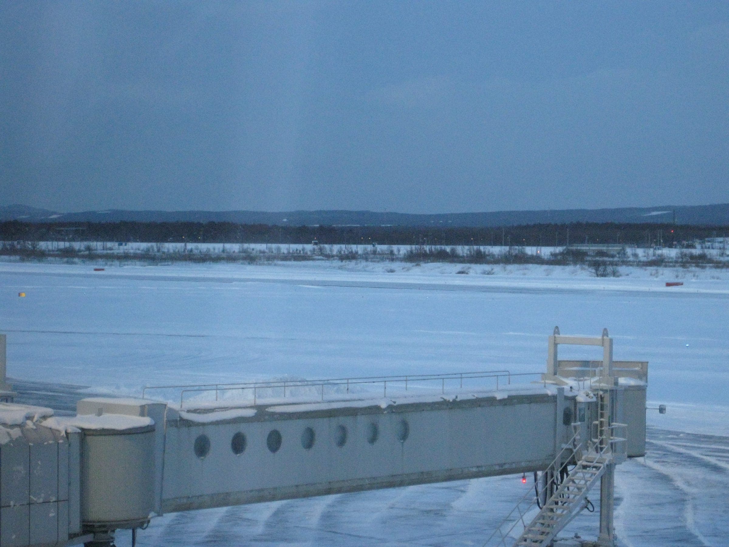 Snow falling at New Chitose Airport, a short drive from FOX Camper's Chitose shop