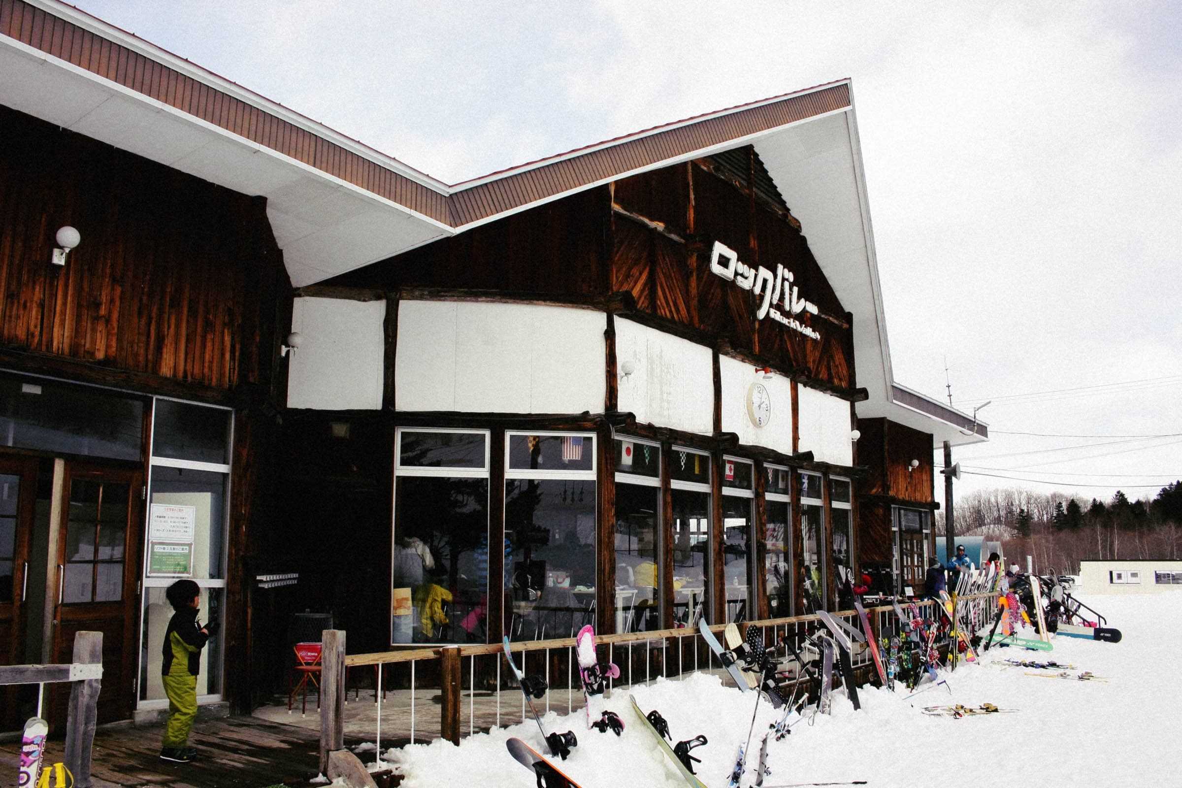 Skis and boards line the racks outside the Rock Valley center house at Engaru on a snowy day