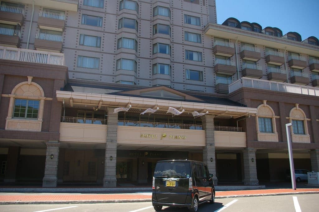 A columned porch fronts the main entrance of Club Med Kiroro Grand, which once traded as Hotel Piano