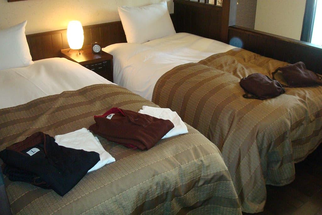 A twin room at La Vista Daisetsuzan with yukata laid out on the beds