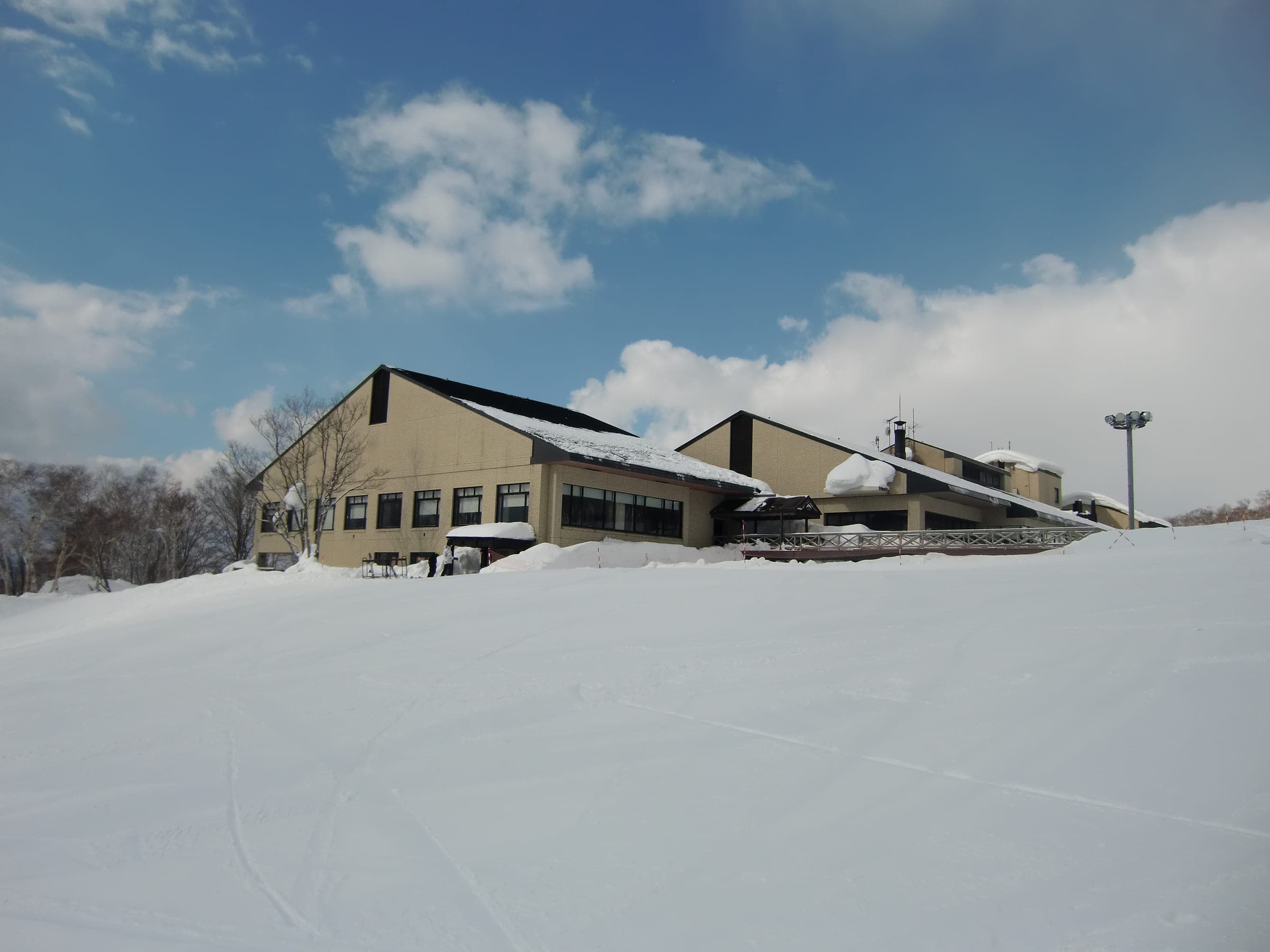 Niseko Northern Resort An'nupuri's gabled hotel building in deep snow at the Annupuri base