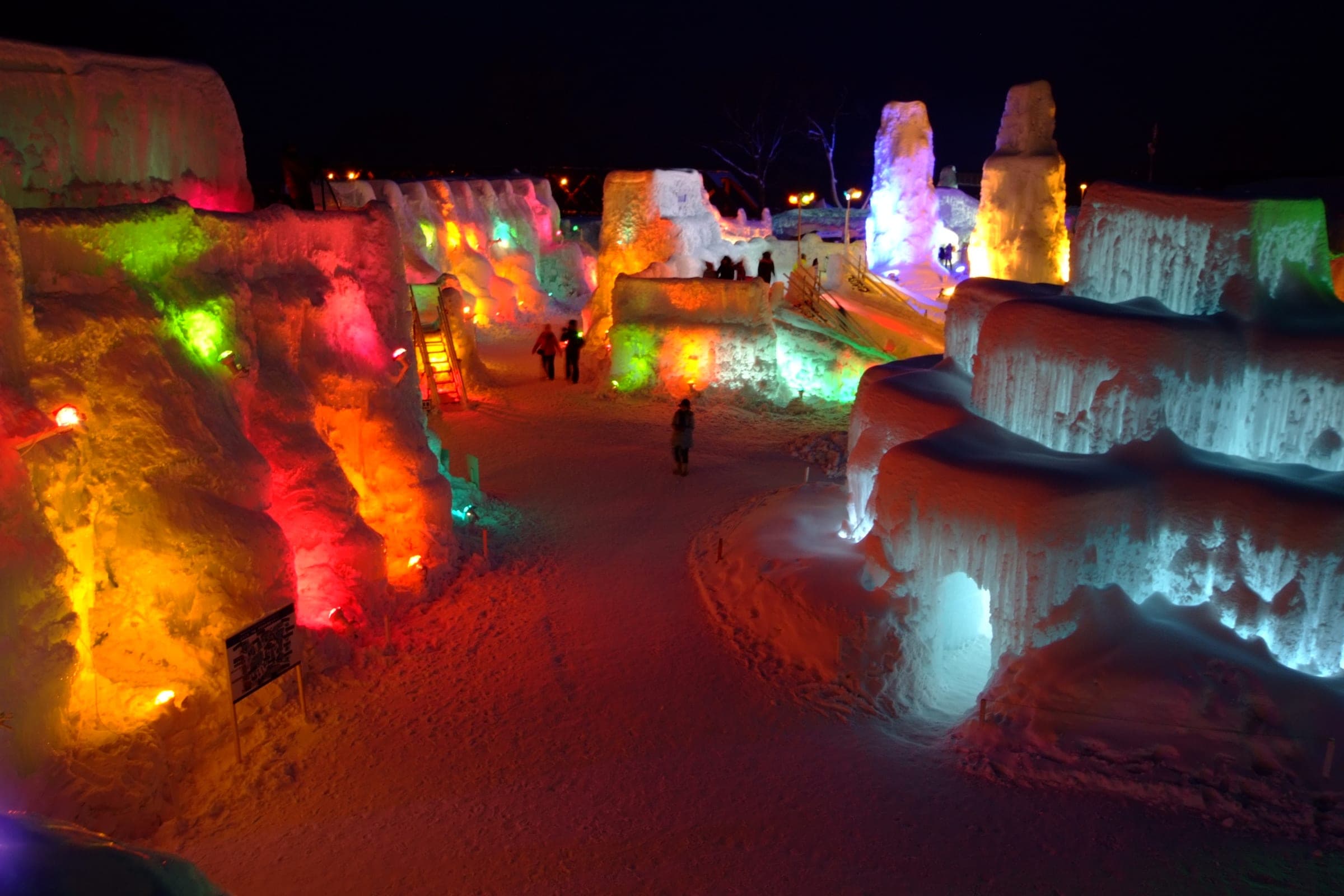 Coloured lights glow through the ice towers of the Lake Shikotsu Ice Festival at Shikotsuko Onsen
