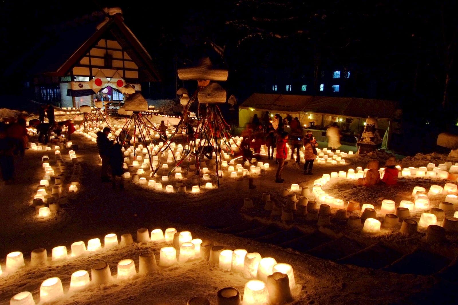 Hundreds of snow lanterns glow outside a shrine during Jozankei Yukitoro