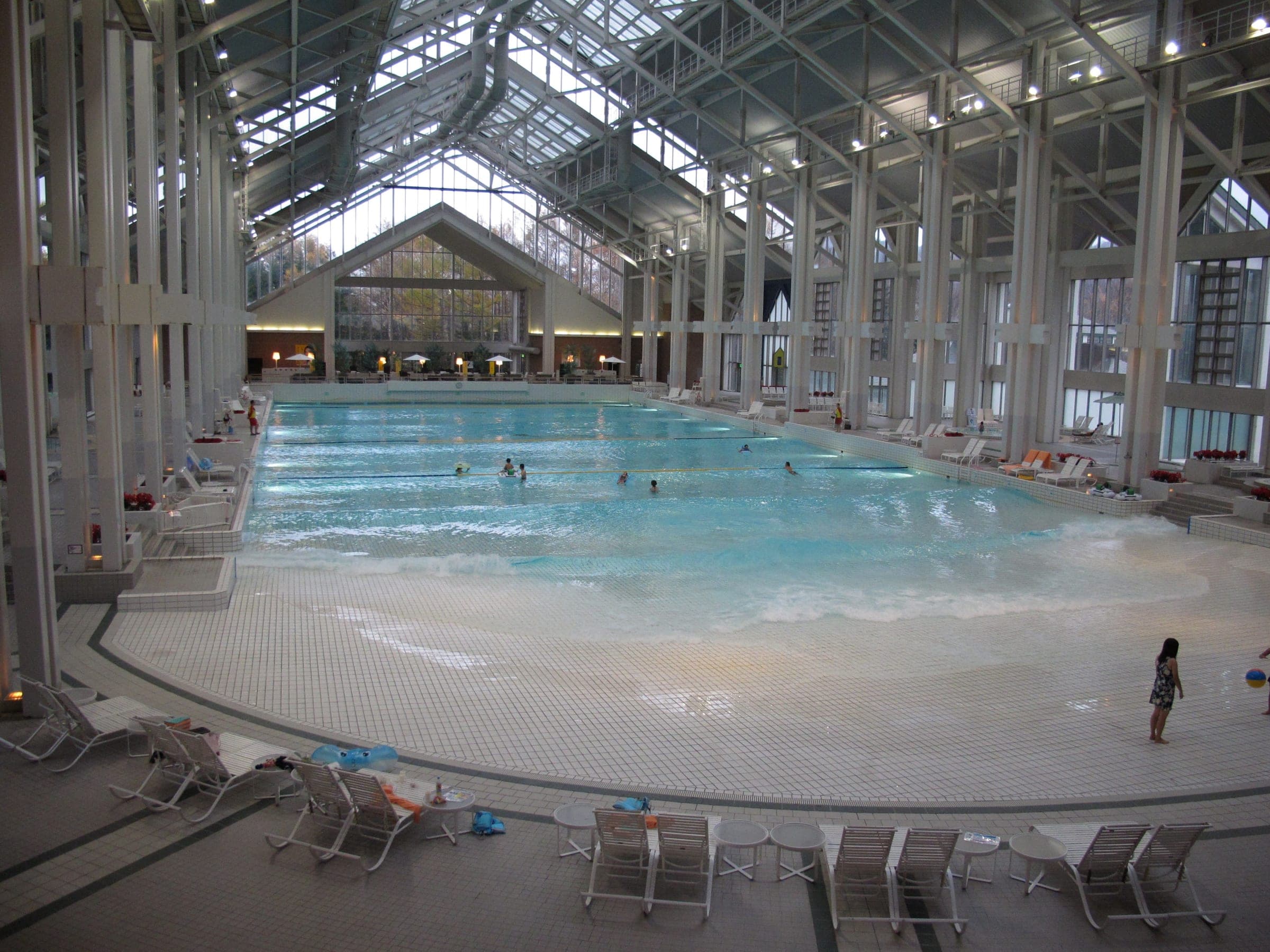 The indoor wave pool of Mina-Mina Beach under its glass roof at Tomamu